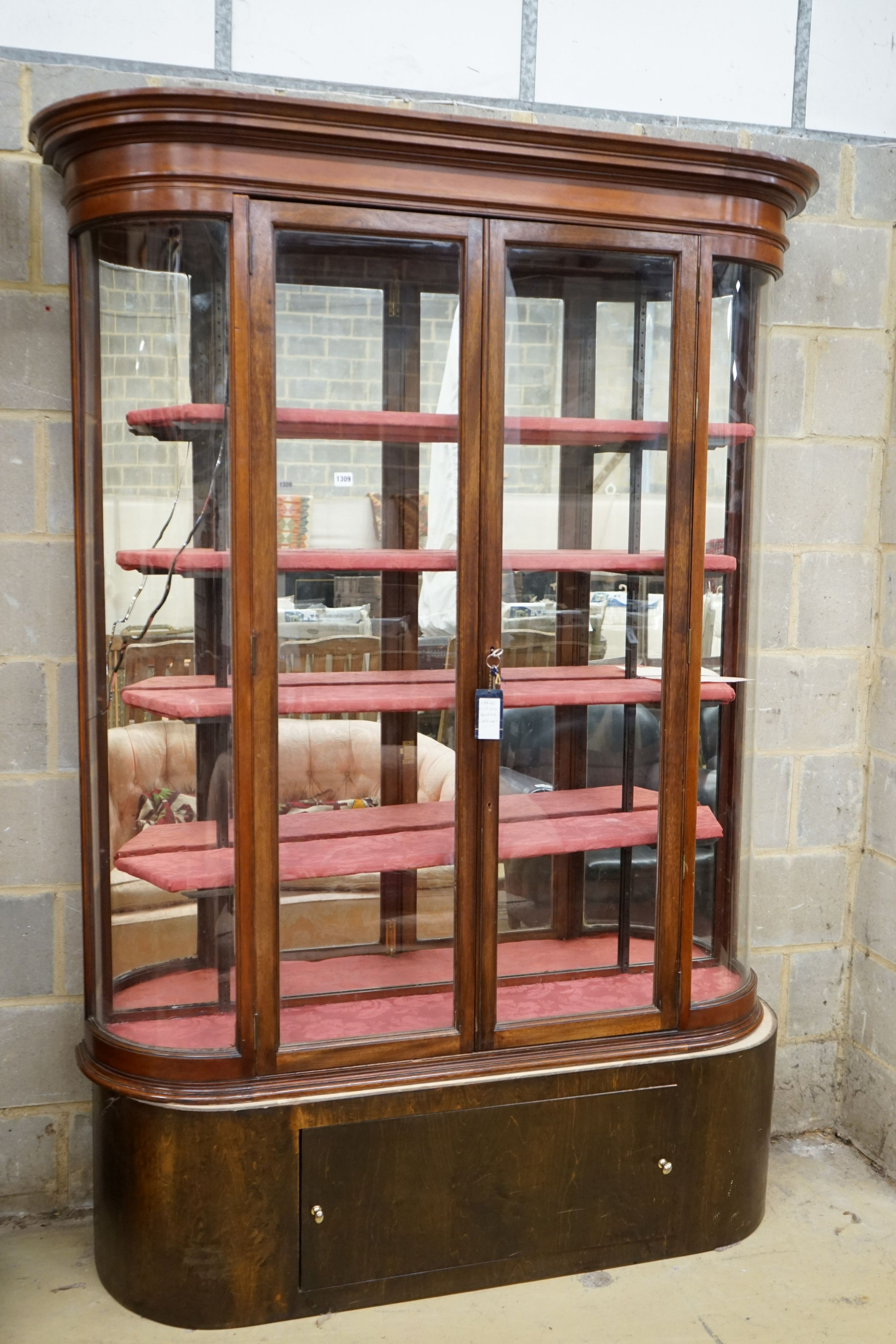 A Victorian mahogany shop display cabinet on later base, width 150cm, depth 32cm, height 209cm